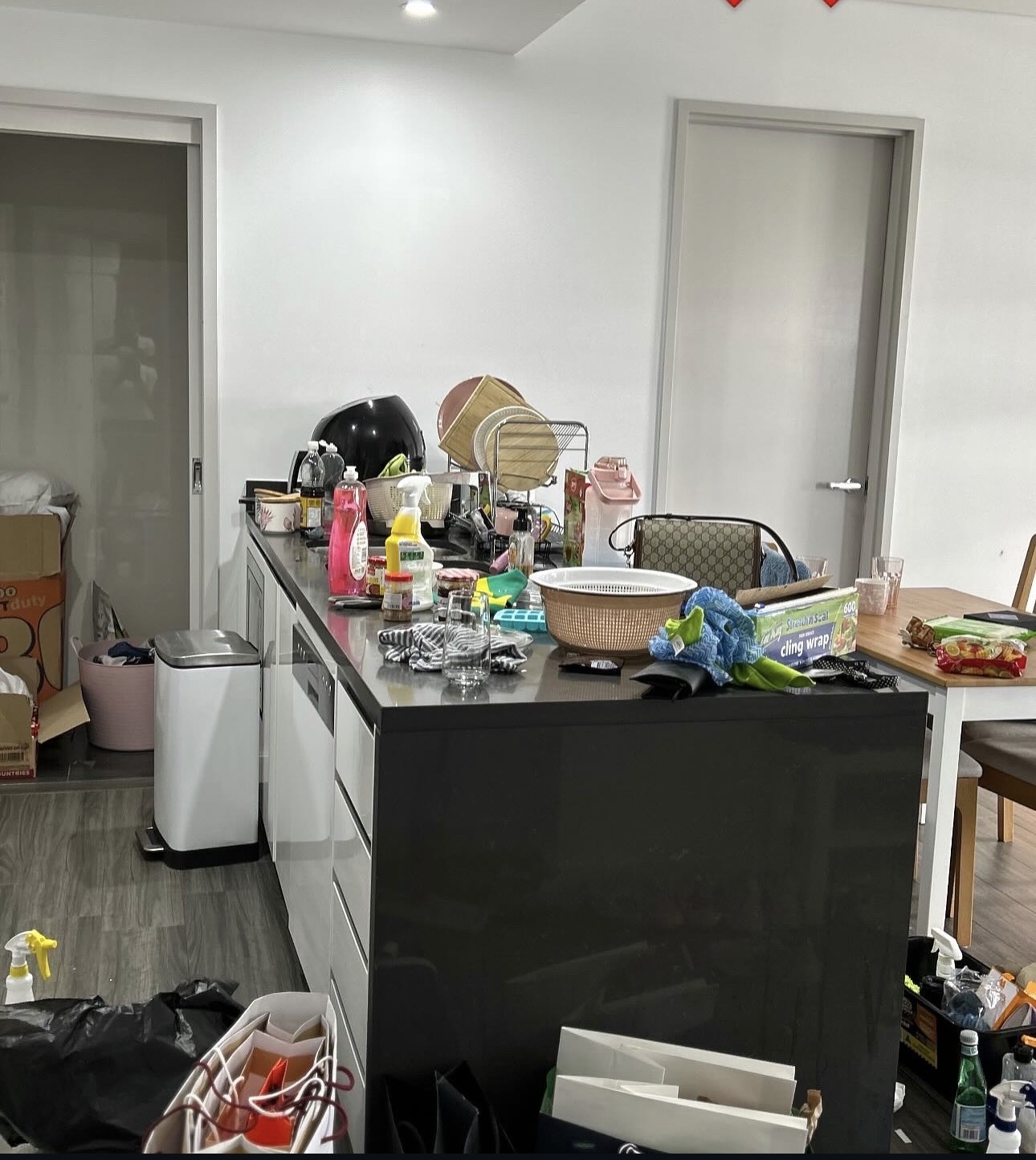 New build interior before cleaning, covered in construction dust and debris